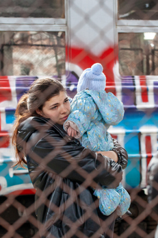 ukrainian refugee holding a baby